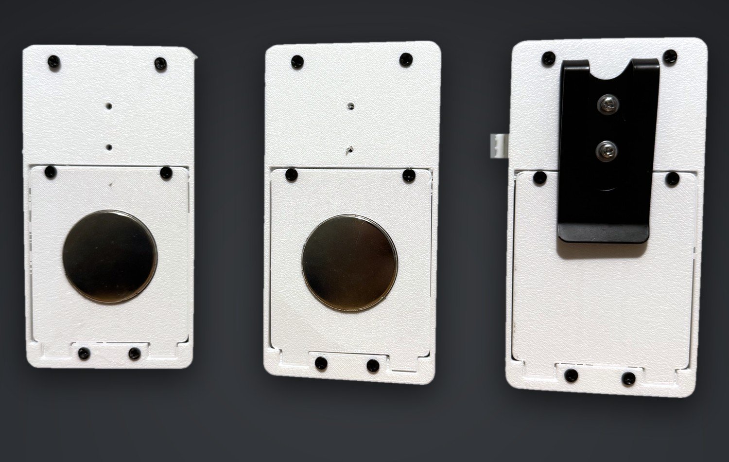 The backs of three INVL counters: two with a recessed magnet pad, one with a black steel spring clip.